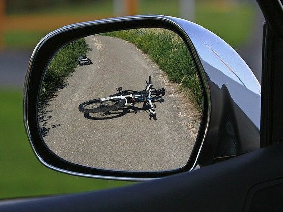 Where lies the liability if you, a cyclist, cause a collision with a stationary car?