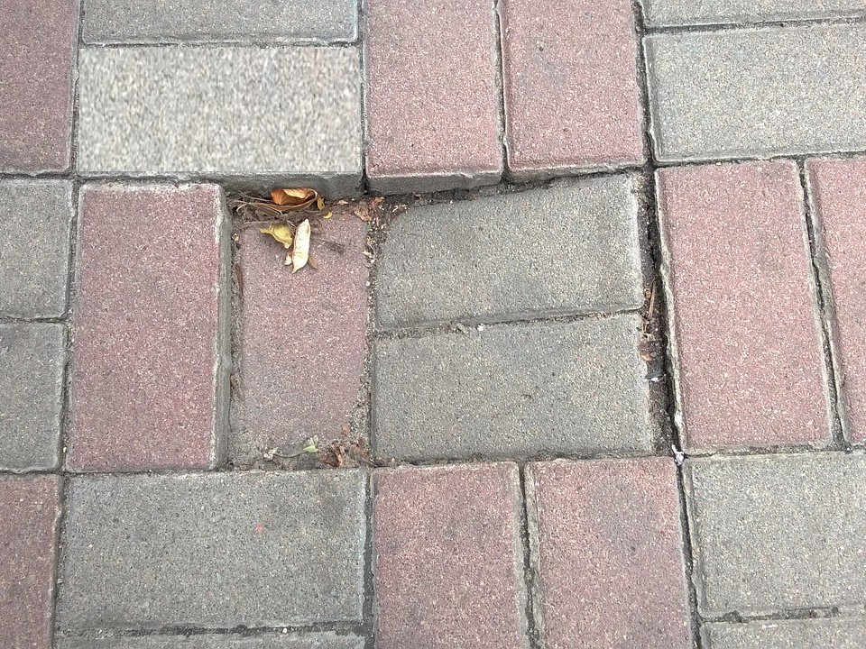 If the road authority was aware of a loose pavement tile but did not take action and did not post a warning sign, you are entitled to compensation.